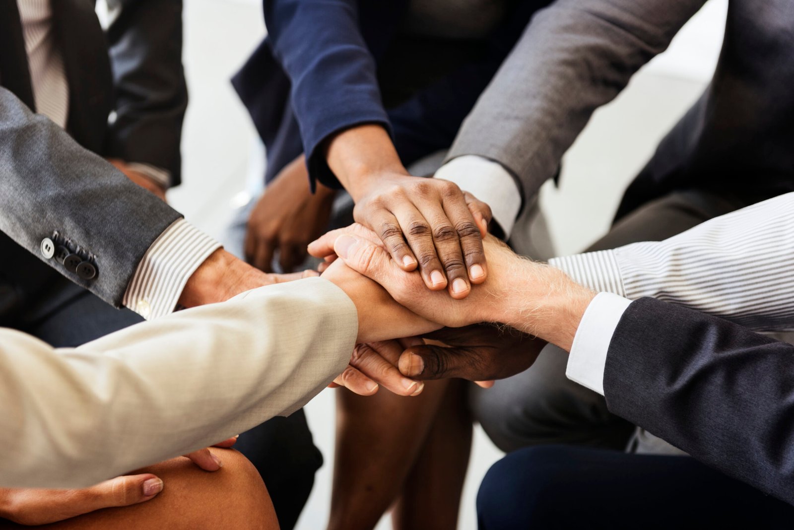 business people joined hands together as teamwork